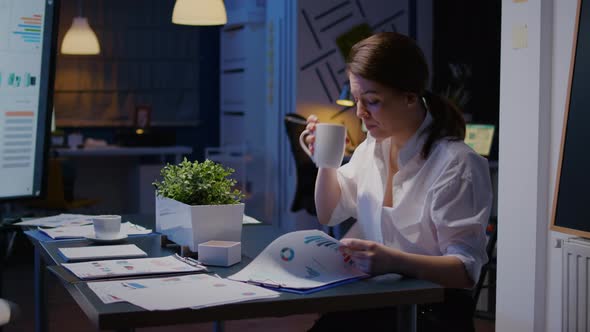 Overworked Businesswoman Working Overtime in Business Company Office Meeting Room in Evening alt