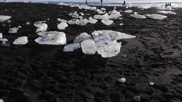 Iceland Jokulsarlon Black Sand Diamond Beach With Iceberg Ice Chunks