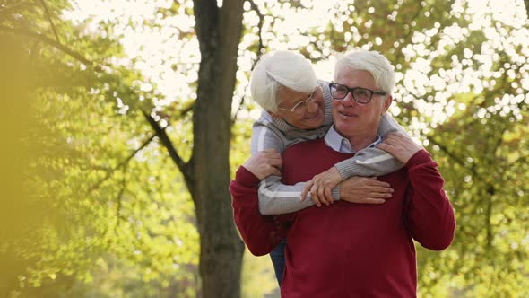 Happy Elderly Marriage Has Fun in the Park alt