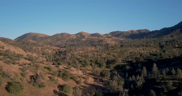 Aerial Parallax of Sierra Nevada mountains in Tehachapi, California, golden hour alt