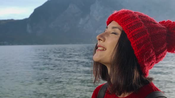 Beautiful Calm Woman Sitting on Rock Coastline alt