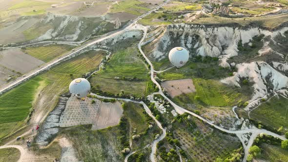 Hot Air Balloons Fly Over the Mountainous Landscape of Cappadocia Turkey alt