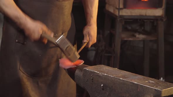 Treatment of Molten Metal Close-up. Handmade Blacksmith.