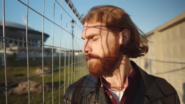 Outdoor Portrait of Young Ginger Man alt