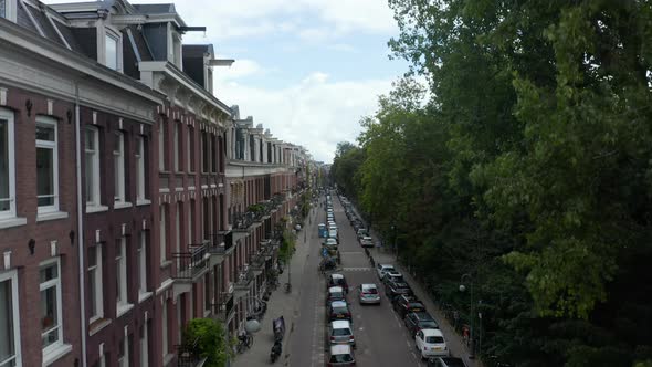 Typicall Dutch Street on Beautiful Fall Day with Clouds and Blue Sky alt