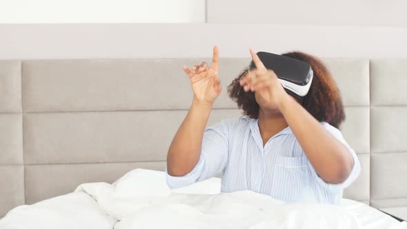 Funny Girl Pointing at Somewhere While Using 3D Device alt