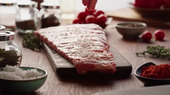 Woman Chef Cooking Ribs Closeup alt