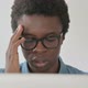 Close Up of Young African Man Having Headache While Working on Laptop - VideoHive Item for Sale