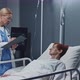 Doctor Interviewing Woman in Hospital Ward - VideoHive Item for Sale