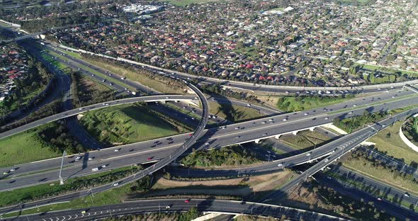 High altitude perspective looking down on major highway intersection arterial connection commuters t alt