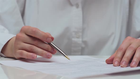 The Woman Signs the Contract alt