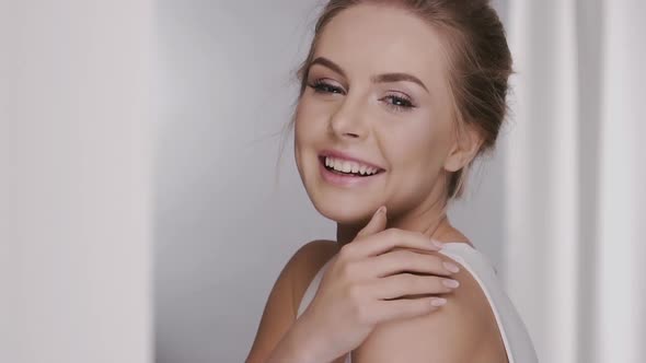 Gorgeous Woman with Perfect Smile Showing Her Beauty Face alt