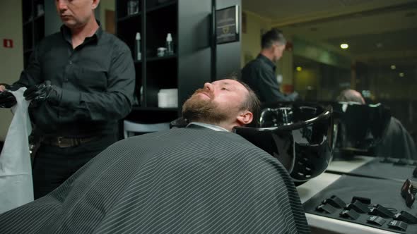 The Barbershop Client Rests Before the Master Begins to Cut alt