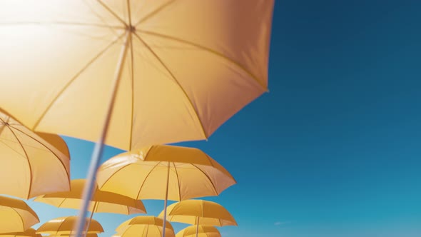 Beach umbrellas against blue sky alt