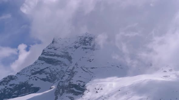 Landscape View of Alpine Mountain Snowy Peak in the Clouds. Simplon Pass alt
