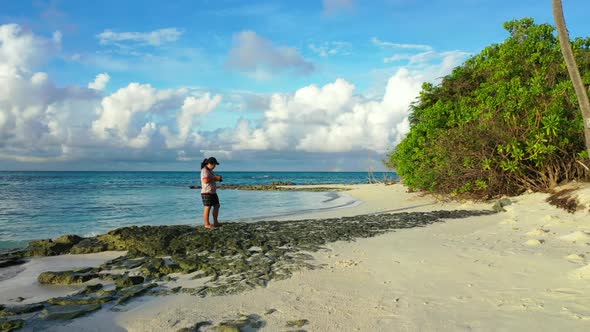 One girl loves life on exotic sea view beach wildlife by blue sea and white sandy background of the  alt