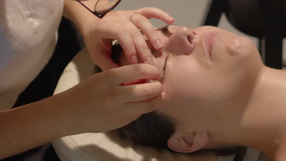 Beauty Therapist Lifts and Attaches Eye Lashes to the Silicone Pad for Lamination Procedure