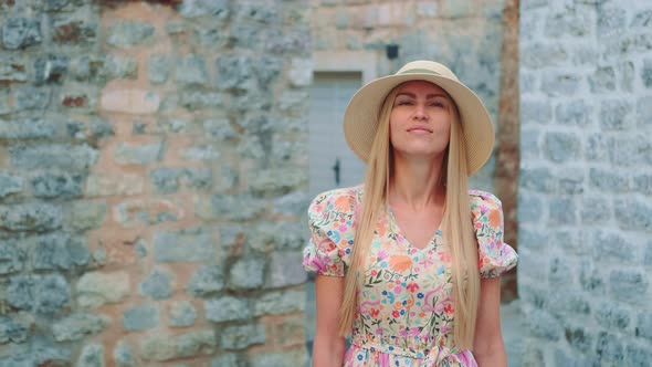 Summer Vacations Blonde Woman in Sun Hat Going Sightseeing