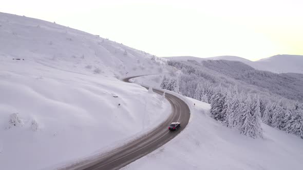 Black Car on Road to Mountain alt