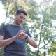 Caucasian Man in Sports Uniform Using Smartwatch to Measure Speed About Physical Body Health - VideoHive Item for Sale