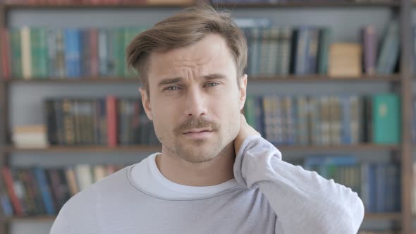 Tired Adult Man Trying to Relax Body by Stretching alt