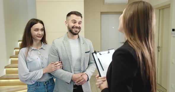 Broker Showing Couple New Flat