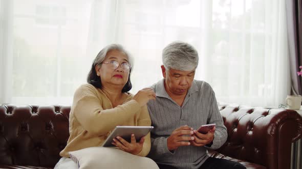 Senior couple use transparent AR screen at home
