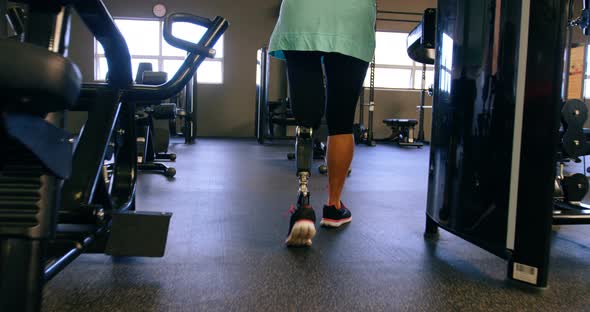 Senior woman walking in fitness studio 4k alt