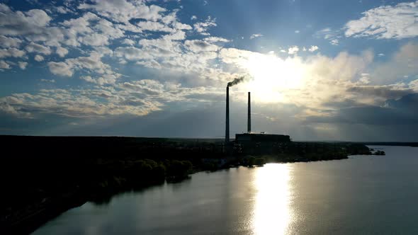Industrial Zone with a Large Pipe Thick White Smoke is Poured From the Factory alt