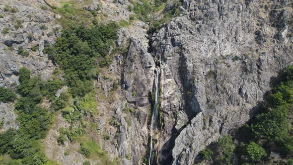 Stream of fresh water, Cascata da Frecha da Mizarela, Arouca, Portugal. Massive waterfall. alt