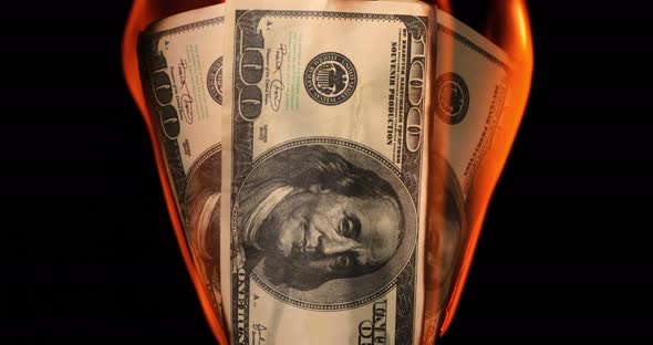 USA Dollar Bill Money Is Burning in the Fire the Concept of the Economic Crisis alt