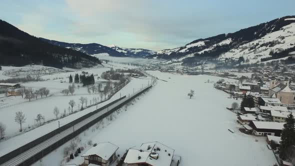 Aerial view of a railway and houses in Kitzbuhel alt