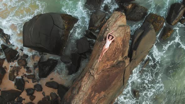 Woman Lying on Rock alt