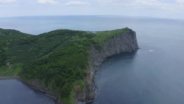 Aerial Drone Footage of Mayachny Cape on Kamchatka Peninsula on Picturesque Avacha Bay Coast Covered