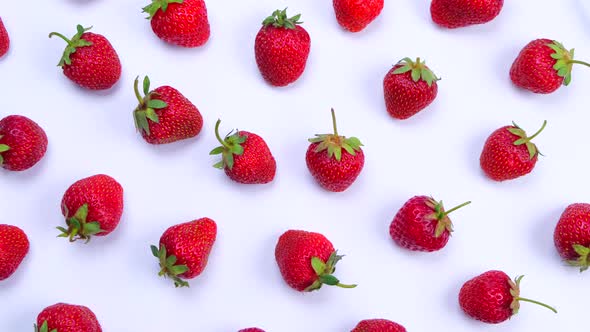 Rotating Ripe Strawberries on a White Background Trendy Bright Summer Background
