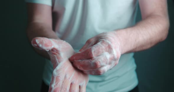Hands washing by a man slow motion 4K