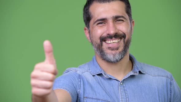 Handsome Persian Bearded Man Giving Thumbs Up