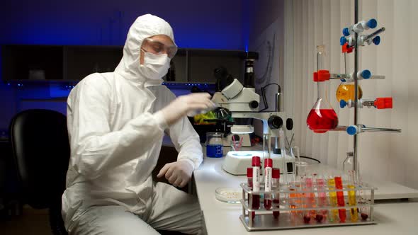 Scientist Examining Samples with Microscope