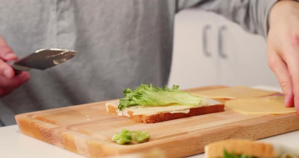 Process of Making a Sandwich with Salad Ham and Cheese alt