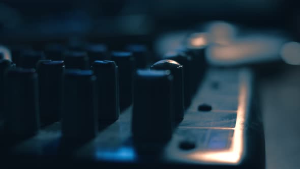Macro of Sound Mixing Console. Mixer Console for Sound Production in Recording Studio. Poor Light alt
