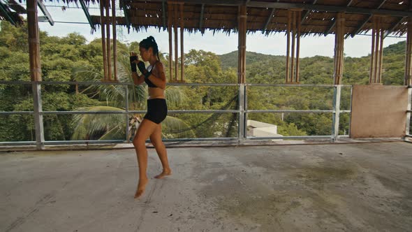 Woman Fighter Trains Her Punches Training Day in the Abandoned Hotel Strength Fit Body alt