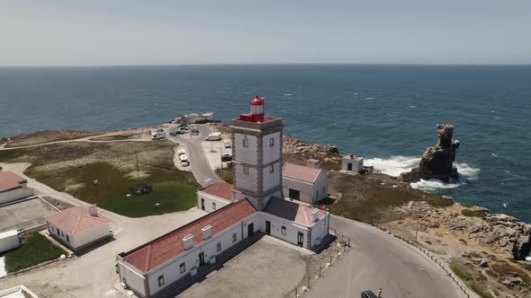 Peniche lighthouse and Cabo Carvoeiro in Portugal. Aerial circling