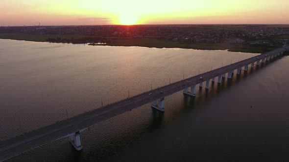 Aerial Shot of a Far-off Bridge Over the Dnipro at Dreamy Sunset in Summer