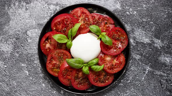 Burrata Cheese Served with Fresh Tomatoes and Basil Leaves Traditional Italian Salad