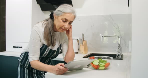 Woman in Kitchen Vegetables, Tablet