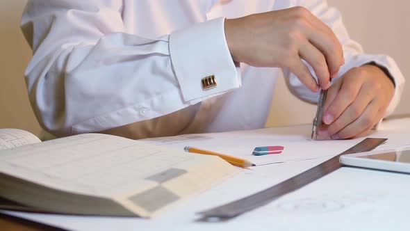 Student Engineer Uses A Compass