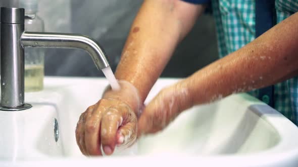 Senior Woman Wash Hand for Prevention of Novel Coronavirus Disease 2019 alt
