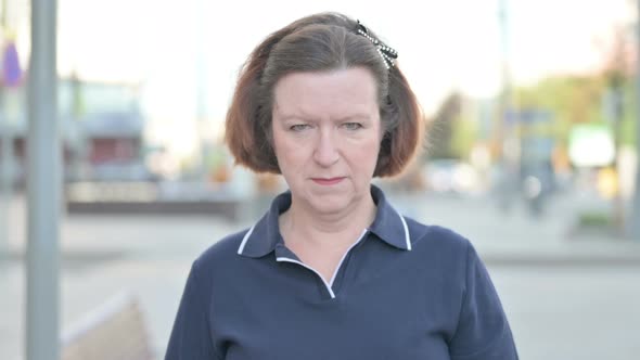 Angry Old Woman Screaming in Frustration Outdoor alt