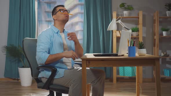 Male Office Worker or Freelancer Sits During Working Hours and Idles or Procrastinates alt