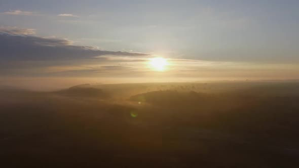 Morning Fog in the Rays of Sunrise